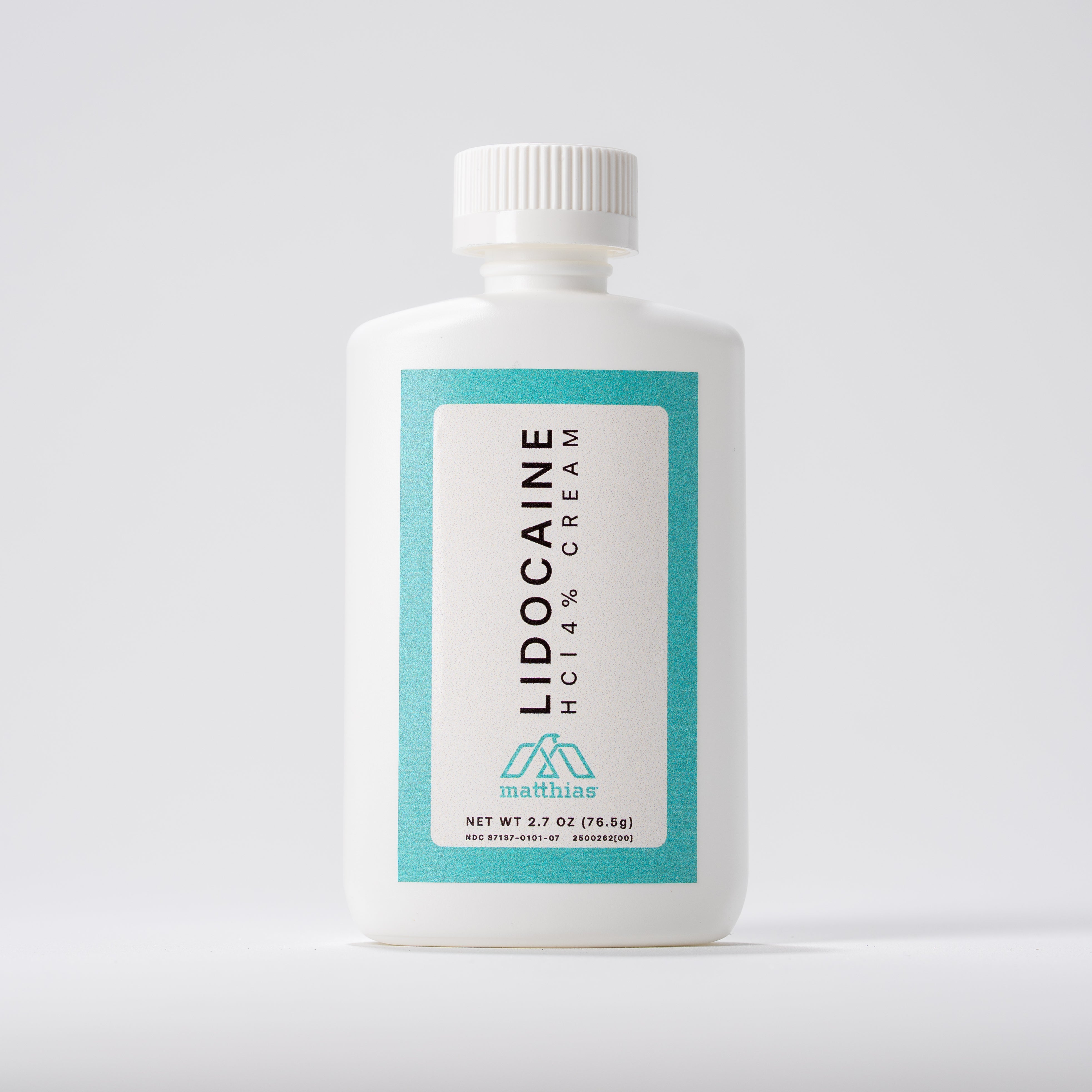 Straight-on front view of a single Matthias Lidocaine HCl 4% Cream bottle with white cap, teal-and-white label, centered on a light gray background.